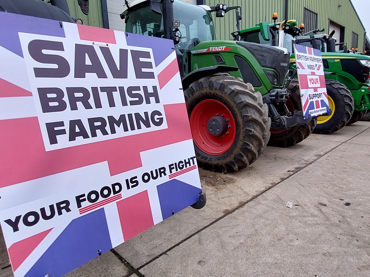 Tractors with "Save British Farming" signs attached
